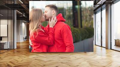 Young couple in love outdoor.Stunning sensual outdoor portrait of young stylish fashion couple. Wall mural