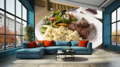 A plate with salad and whale meat Wall mural