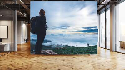 Asian women travel sleep relax. Morning atmosphere nature Forests, mountains. Phu Thap Buek Thailand Wall mural