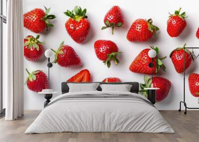 Assortment of fresh strawberries on a white background, isolated with clipping path, captured from above Wall mural