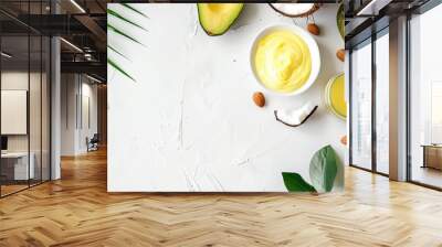 Avocado and coconut themed photo design template with yellow cream in dish on white background, lab items around, space for text Wall mural