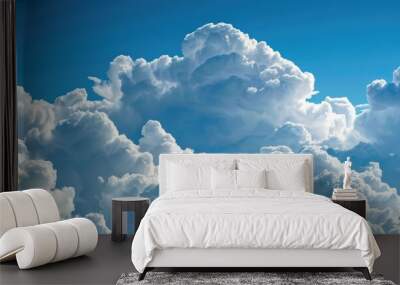 Beautiful fluffy white clouds contrasted with a blue sky. Wall mural