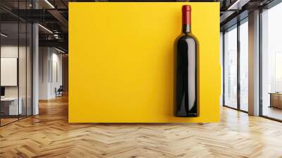 Blank labeled wine bottle with red wine on yellow backdrop. Wall mural