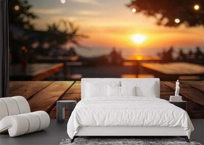 Blurred sunset background with empty wooden table and bar counter. Wall mural