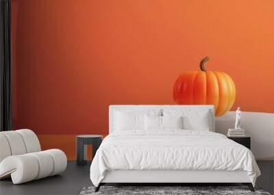 Concept of Halloween or Thanksgiving celebration with a small pumpkin on a white podium. Wall mural