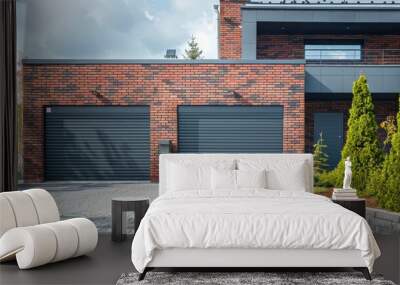 Contemporary brick residential garage with grey rolling shutters. Closed garage doors. Wall mural