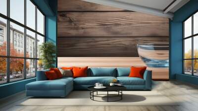 Empty wooden table with a bowl of water. Ample room for text. Wall mural