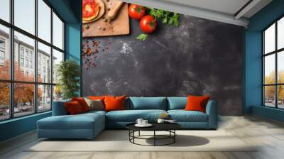 Food recipe concept with a pizza or bread cutting board on a table. Panoramic top view with stone background texture and copy space. Wall mural