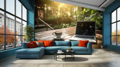 In a lush garden, a laptop and a white coffee cup are placed on a wooden table with lovely, warm lighting. Generative AI Wall mural