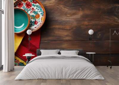 Mexican-themed table top view with rustic wooden table and empty mud dish, decorated with traditional fabric. Wall mural