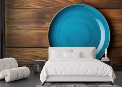 Top view of a vacant blue plate on oak wooden backdrop. Copy space available. Wall mural