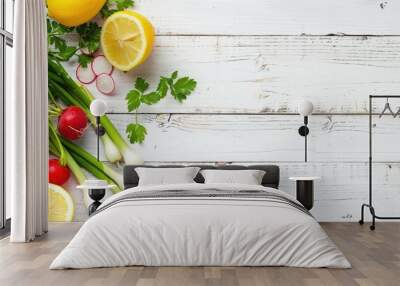 Top view of a white wooden kitchen table with fresh cooking ingredients and space for text. Included are vegetables and herbs suitable for making a salad: radish, spring onion, parsley, and lemon. Wall mural