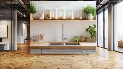 Well lit Scandinavian kitchen with a window in front of the sink wooden counters accessories pot plants and the idea of mortgage and relocating to a modern apartment Wall mural