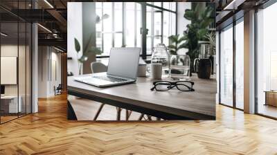 Workplace in a contemporary apartment or café. Glasses on the tabletop and an open laptop. Technology utilization, remote working from home, and business concept. Text placement and arrangement Wall mural