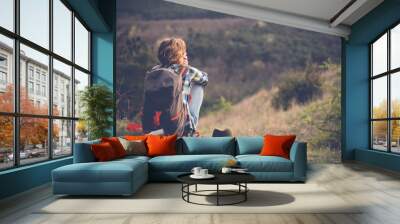 young woman watching landscape, posing outdoor. active lifestyle concept. Wall mural