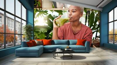 Healthy, black woman and drinking a green smoothie for nutrition with vegetables for supplement. Girl, detox and enjoying a vegan drink for home or weightloss with vitamin or plants and fruit shake. Wall mural