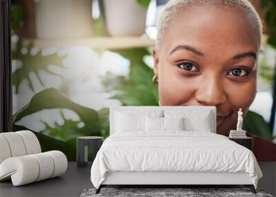 Portrait, plant and flare with a black woman gardener in her home for sustainability or green growth. Face, beauty and smile with a happy young female person in a nursery for eco conscious gardening Wall mural