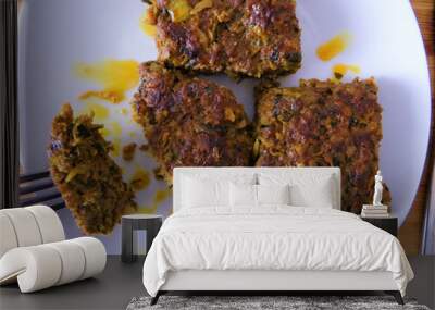 Overhead shot of delicious homemade patties on a plate Wall mural