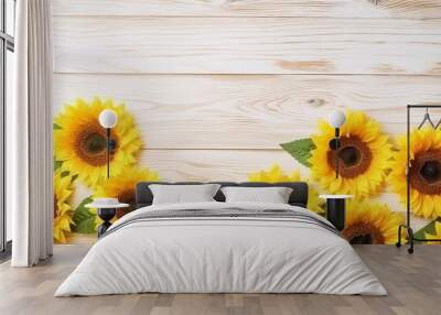 Bright sunflowers border on light wooden background with copy space Wall mural