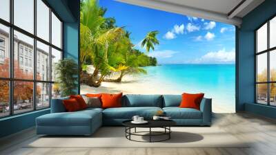 Beautiful beach with white sand, turquoise ocean, blue sky with clouds and palm tree over the water on a Sunny day. Maldives, perfect tropical landscape, wide format. Wall mural