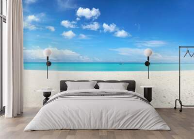 Beautiful beach with white sand, turquoise ocean and blue sky with clouds in sunny day. Panoramic view. Natural background for summer vacation. Wall mural