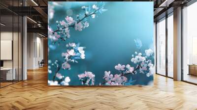 Beautiful floral spring abstract background of nature. Branches of blossoming apricot macro with soft focus on gentle light blue sky background. For easter and spring greeting cards with copy space. Wall mural