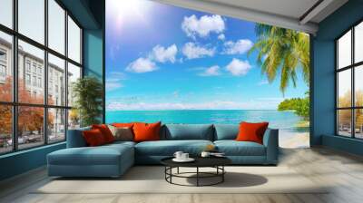 Beautiful natural tropical panoramic landscape with white sand, a palm tree bowed to the water and green vegetation. Turquoise ocean on background blue sky with clouds on sunny summer day. Wall mural