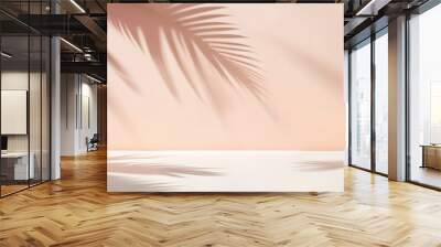 Blurred shadow from palm leaves on the light pink wall. Minimal abstract background for product presentation. Spring and summer. Wall mural