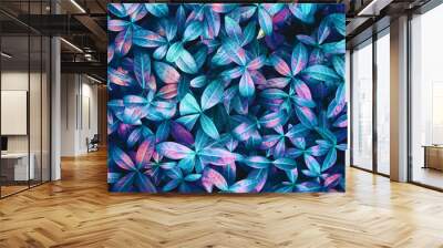 Creative layout made of blue nature leaves. Flat lay. Leaves texture background, blue and pink purple tone. Wall mural