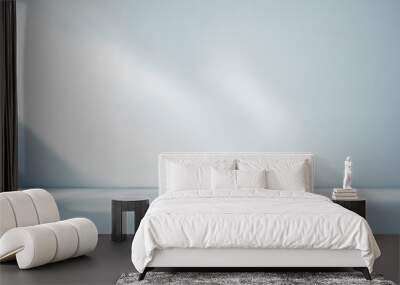 Minimal abstract light blue background for product presentation. Shadow and light from windows on plaster wall. Wall mural