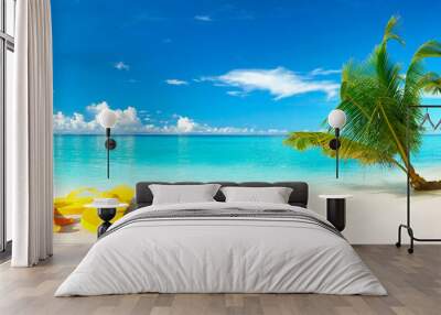 White sand beach, turquoise ocean, blue sky, clouds, palm tree over water, sunglasses, flip-flops and starfish. Maldives, perfect tropical landscape, ultra wide format, concept of summer vacation. Wall mural