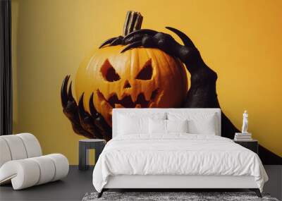 pumpkin on a black monster hand  Wall mural