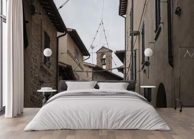 Spectacular traditional italian medieval alley in the historic center of beautiful little town of Spello (Perugia), in Umbria region -  central Italy Wall mural