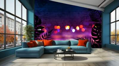 Background of an empty room with brick walls and neon lights. Silhouettes of tropical leaves, colorful smoke Wall mural