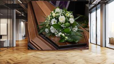 bouquet of white flowers on a coffin in the cemetery Wall mural