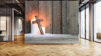 White candles glowing behind wood cross Wall mural