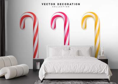 Red and yellow candy canes isolated on white background Wall mural