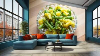 Traditional vegan libanese potato salad with green beans, garlic, parsley and black caraway Wall mural