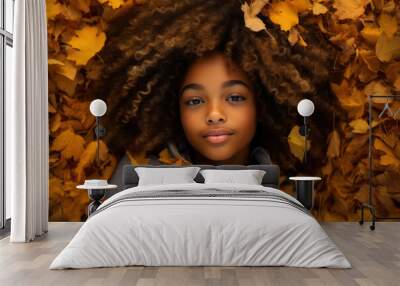 child in autumn park, afro hair, autumn colours, multicultural diverse portrait Wall mural