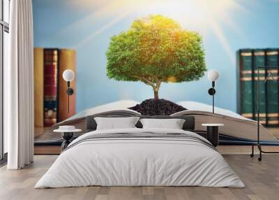 World philosophy day concept with tree of knowledge planting on opening old big book in library Wall mural