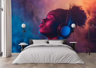 Black woman wearing casual attire listening music on bright background. Portrait of man with headphones against neon colored backdrop Wall mural