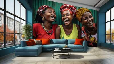 Happy African women in traditional dresses and headscarves. Black women have positive emotions Wall mural