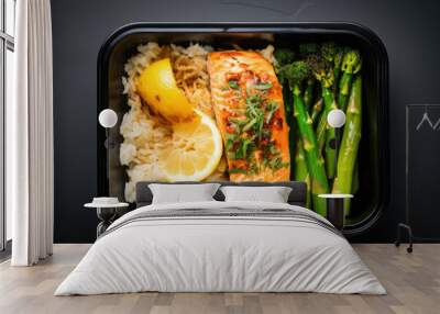 Rice with grilled salmon and asparagus in container. Prepared food for healthy nutrition in lunch box. Catering service for balanced diet. Wall mural