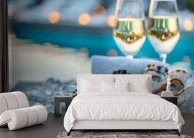 Romantic setting with plate of fresh oysters and two glasses of sparkling wine on terrace against sea Wall mural