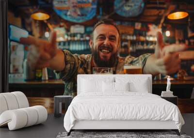 Tipsy man sits in pub and drinks pint of beer. Drunk man has fun in bar with glass of beer Wall mural