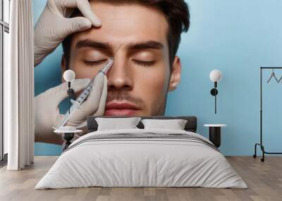 Young beautiful man receives botox injection for facelifting. Male aesthetic medicine. Cosmetology procedure in beauty clinic Wall mural