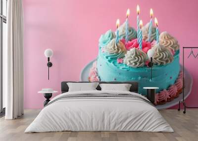 Birthday Cake with Candles. A beautifully decorated birthday cake with lit candles on pink pastel background with copy space, light pastel colors Wall mural