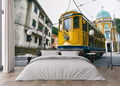 Iconic bonde tram travels along the streets of the tourist nieghborhood of Santa Teresa in Rio de Janeiro, Brazil  Wall mural