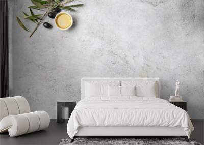 Food background with linen napkin, olive tree branch, olive oil on concrete background Wall mural