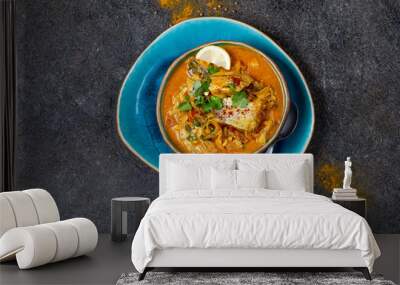 INDIAN FOOD. Traditional KERALA FISH CURRY with naan bread, gray plate, black background  Wall mural